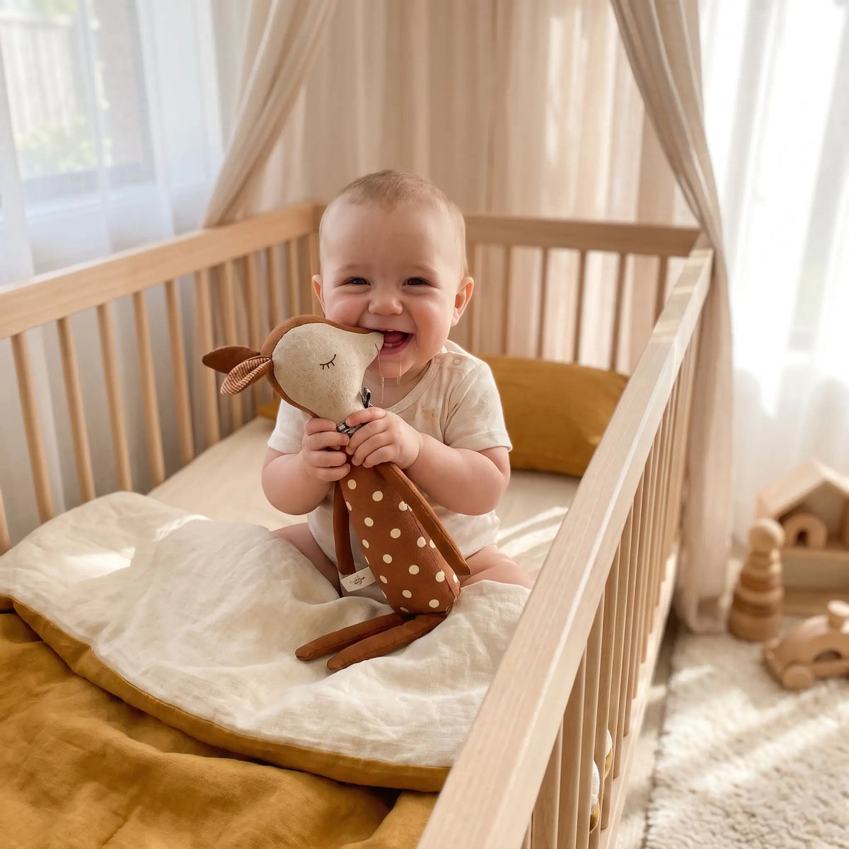 Doudou bébé dans son lit