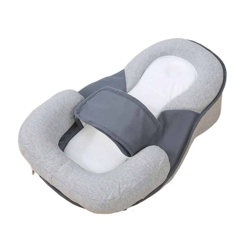 Réducteur de lit bébé attache