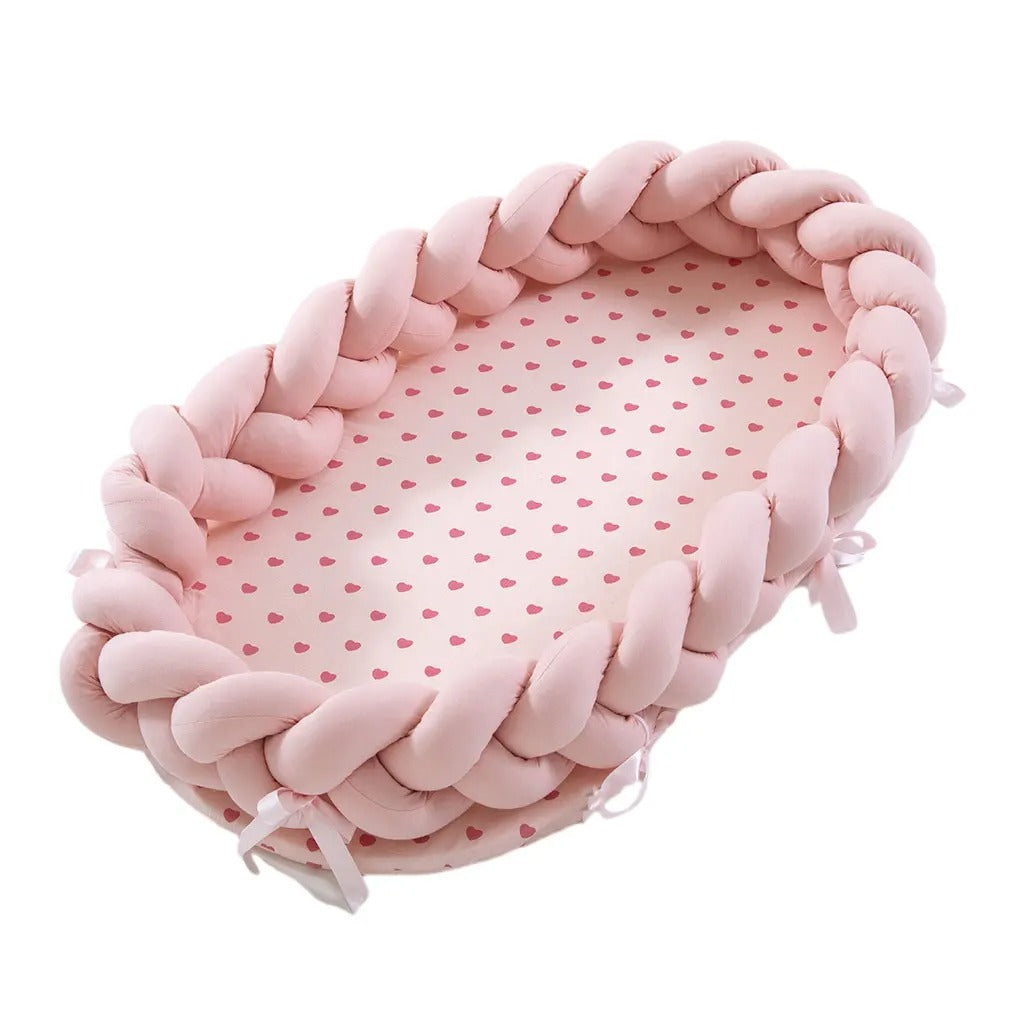 Réducteur de lit bébé rose