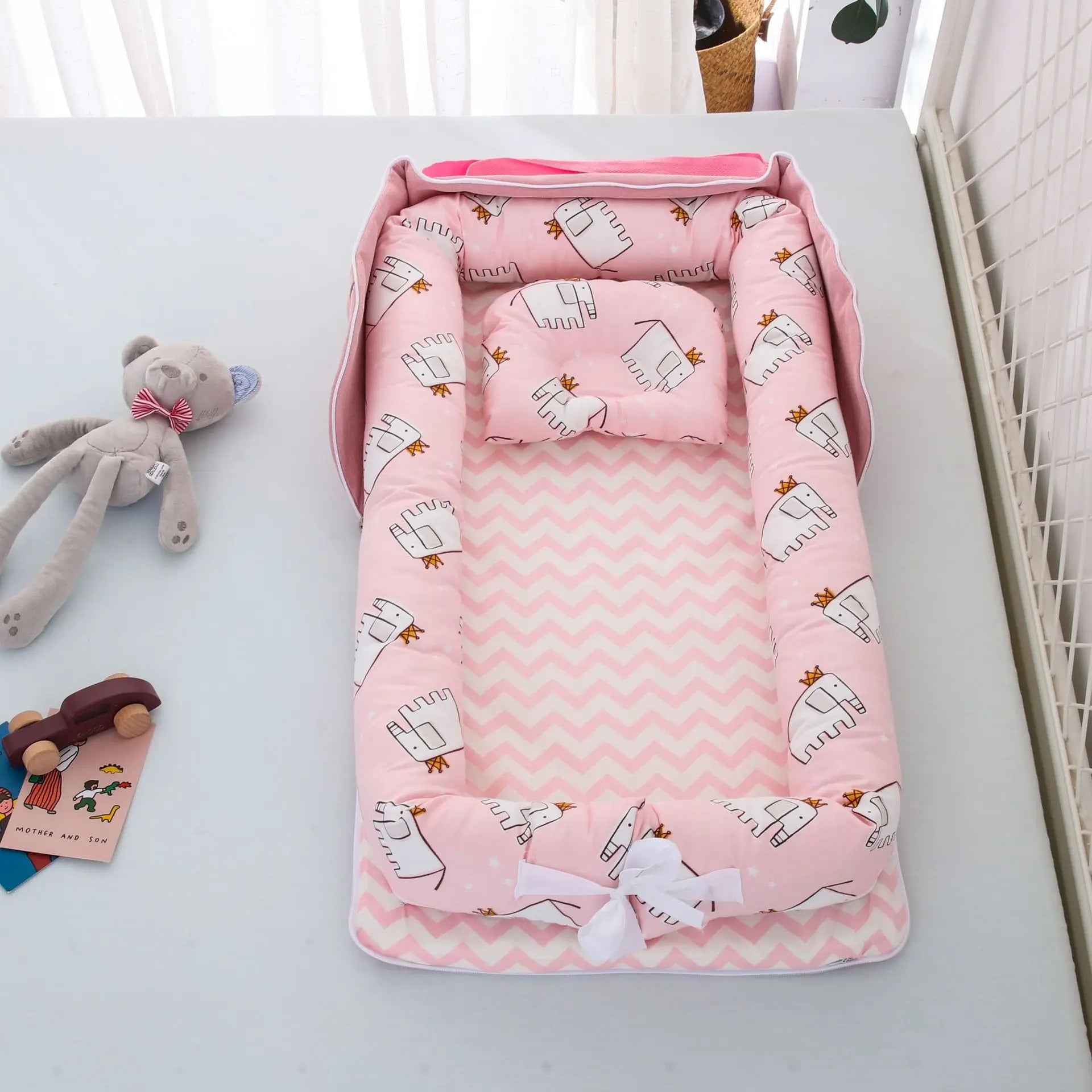 Réducteur de lit rose
